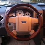 Steering wheel that was recovered and wood grain added in a Ford F150 King Ranch 